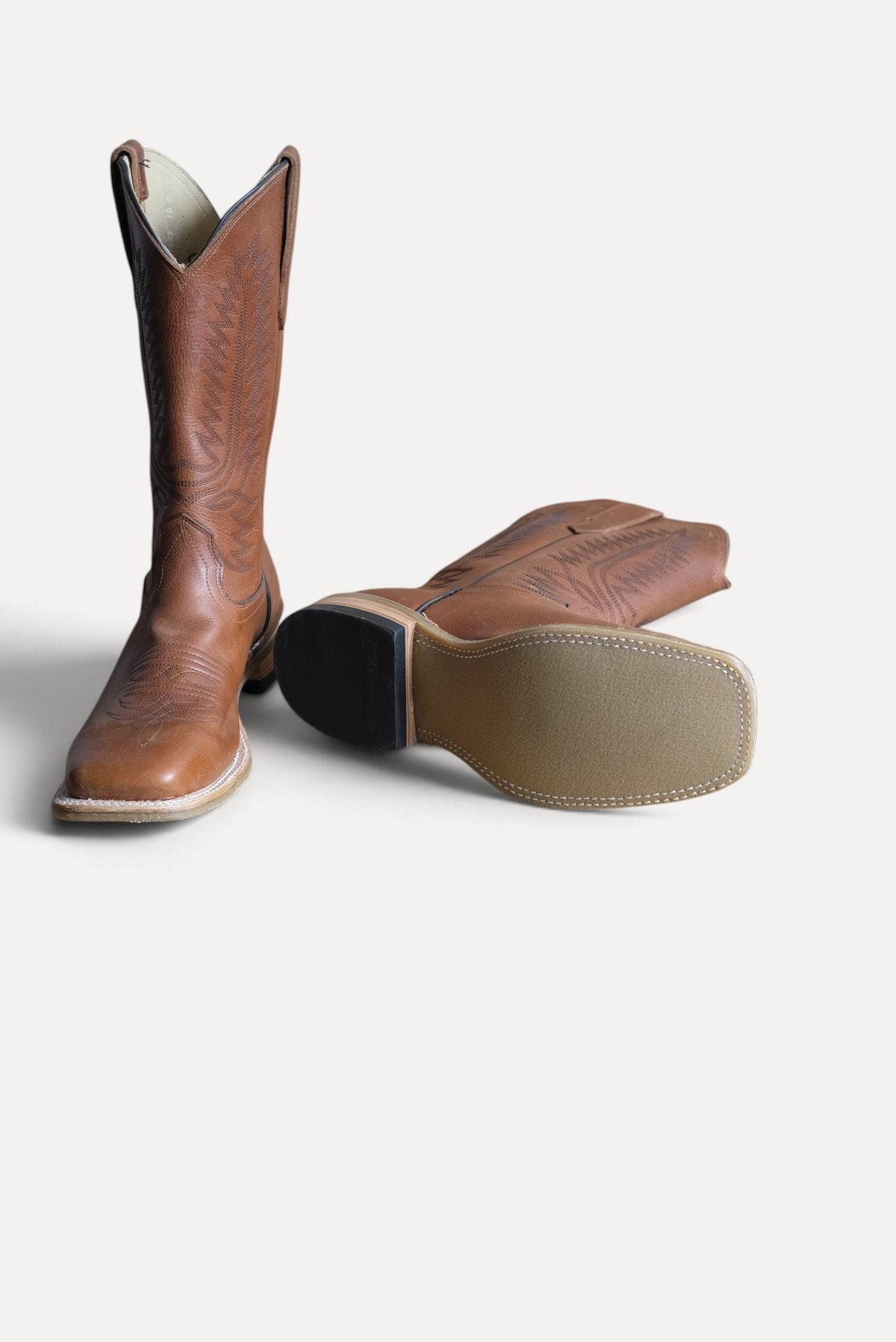 Cognac OPU square toe cowboy boots showing the Ranch Tough sole
