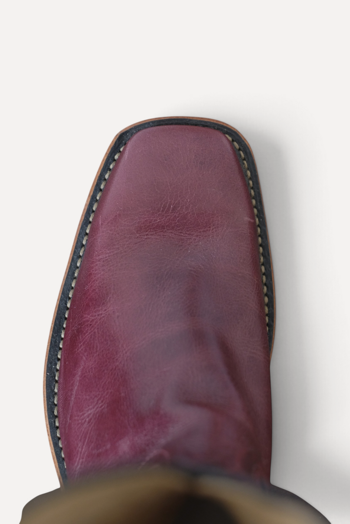 Top down view of a cabernet leather square toe cowboy boot