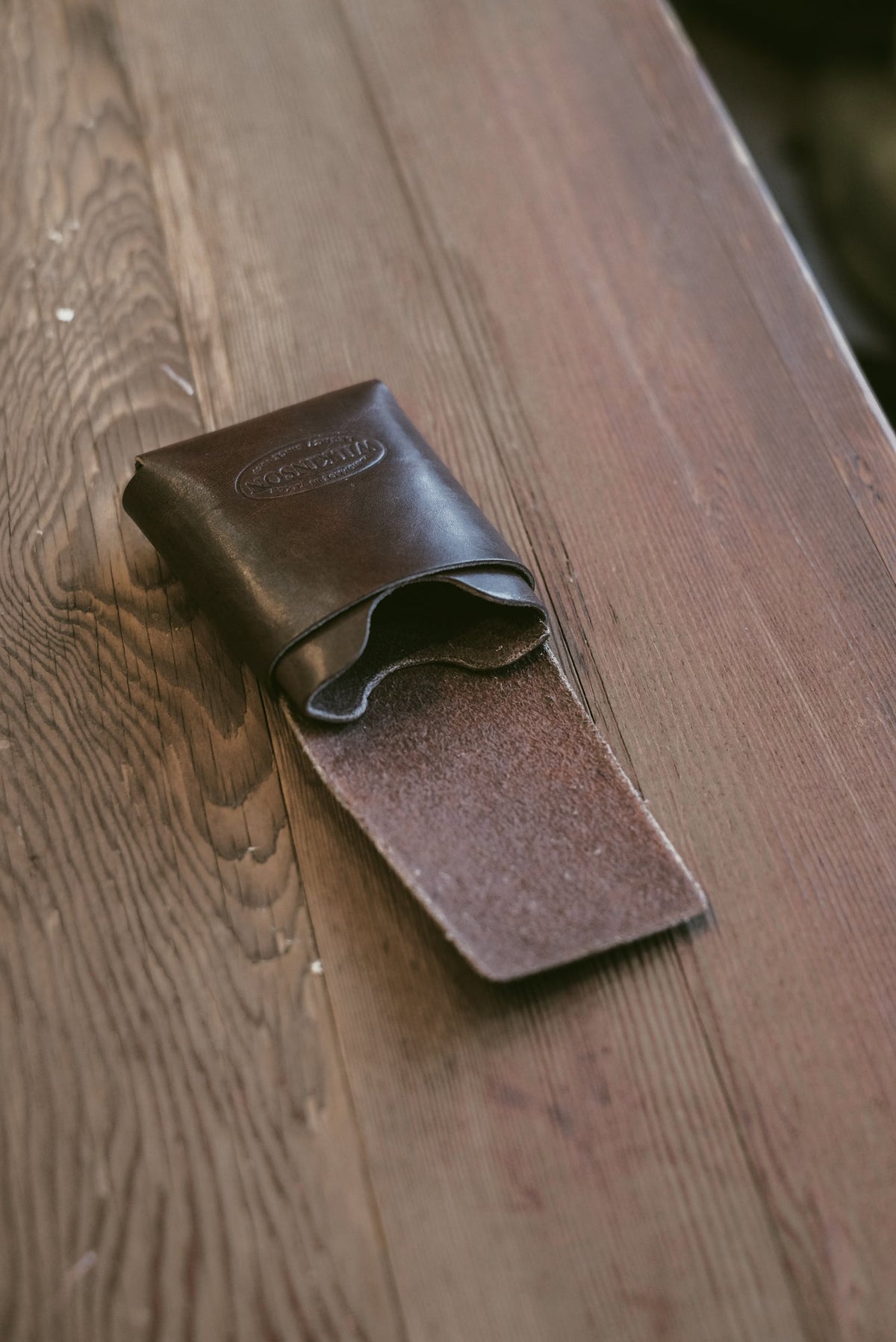 Wilkinson's Fine Goods Fry wallet in dark brown full-grain leather with a minimalist stitch-free design