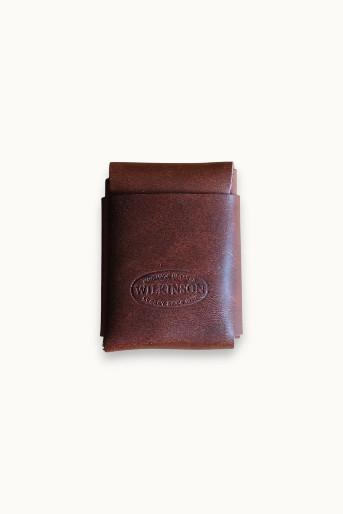 Wilkinson's Fine Goods Fry wallet in brown full-grain leather with a minimalist stitch-free design and logo stamp.