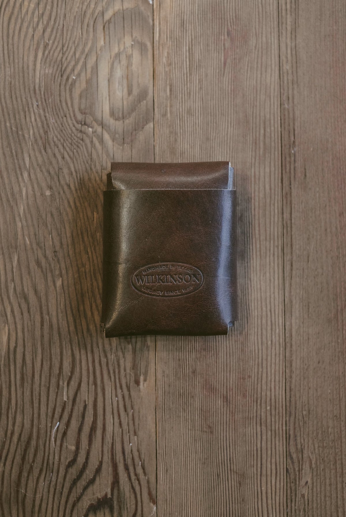 Wilkinson's Fine Goods Fry wallet in dark brown full-grain leather with a minimalist stitch-free design