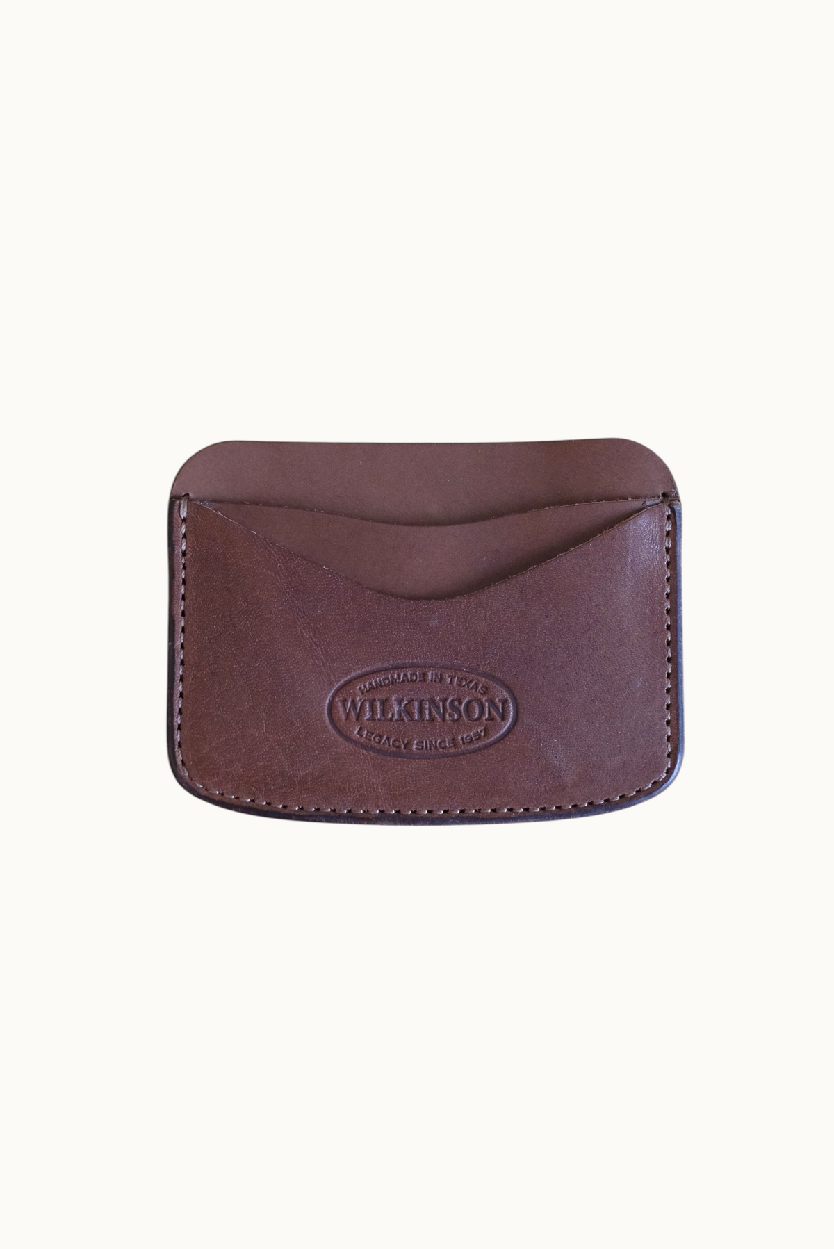 Wilkinson's Fine Goods Hickory slim brown leather card wallet with embossed logo on a neutral background