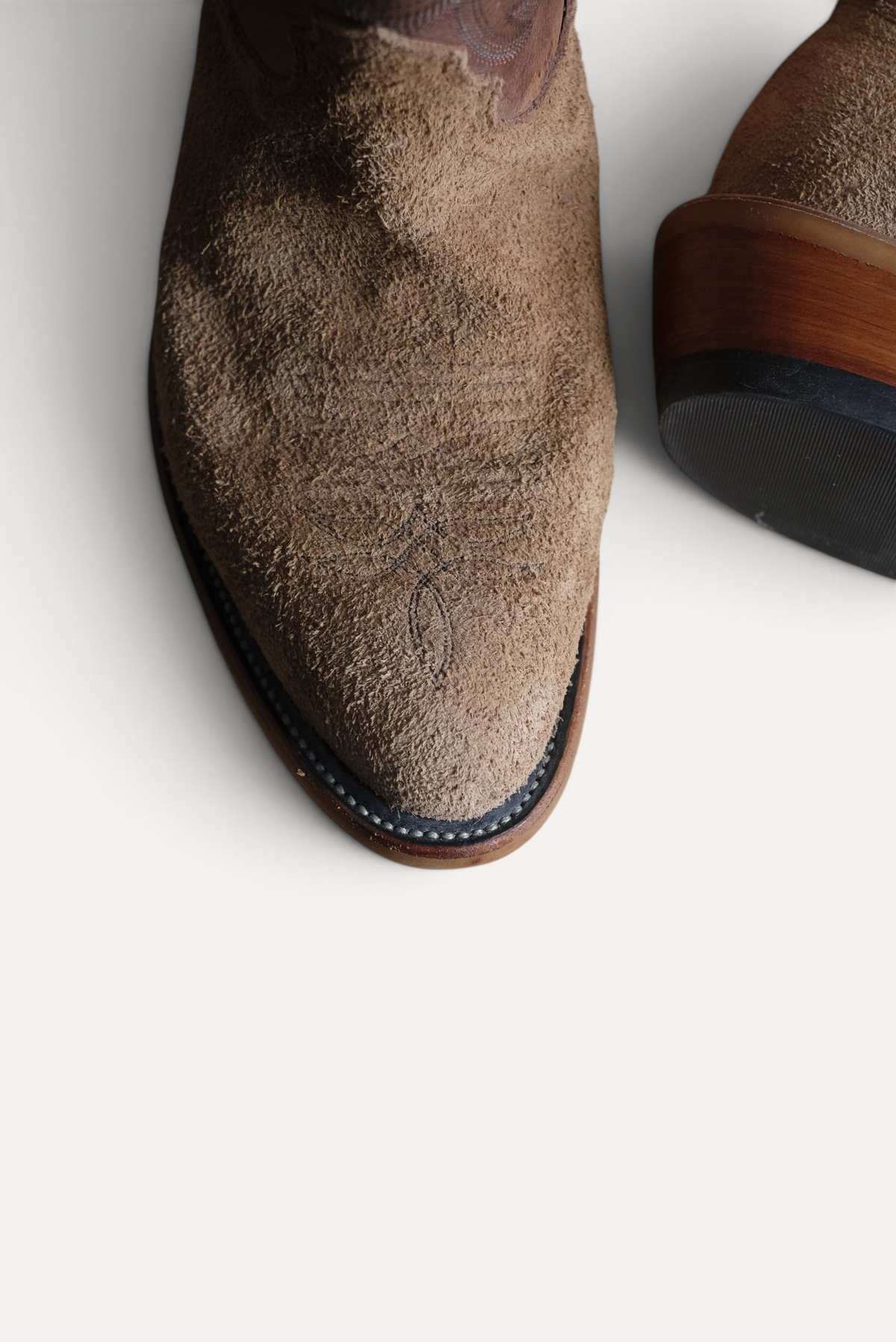 Close up of tan roughout vamp with toe stitching