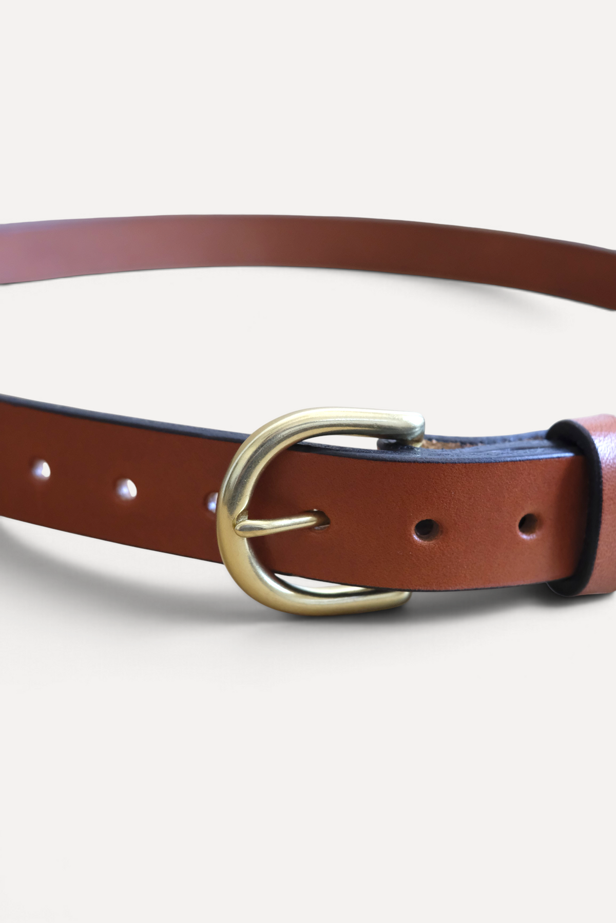 Wilkinson's Fine Goods 1-inch brown English bridle leather belt with a natural brass heel bar buckle.