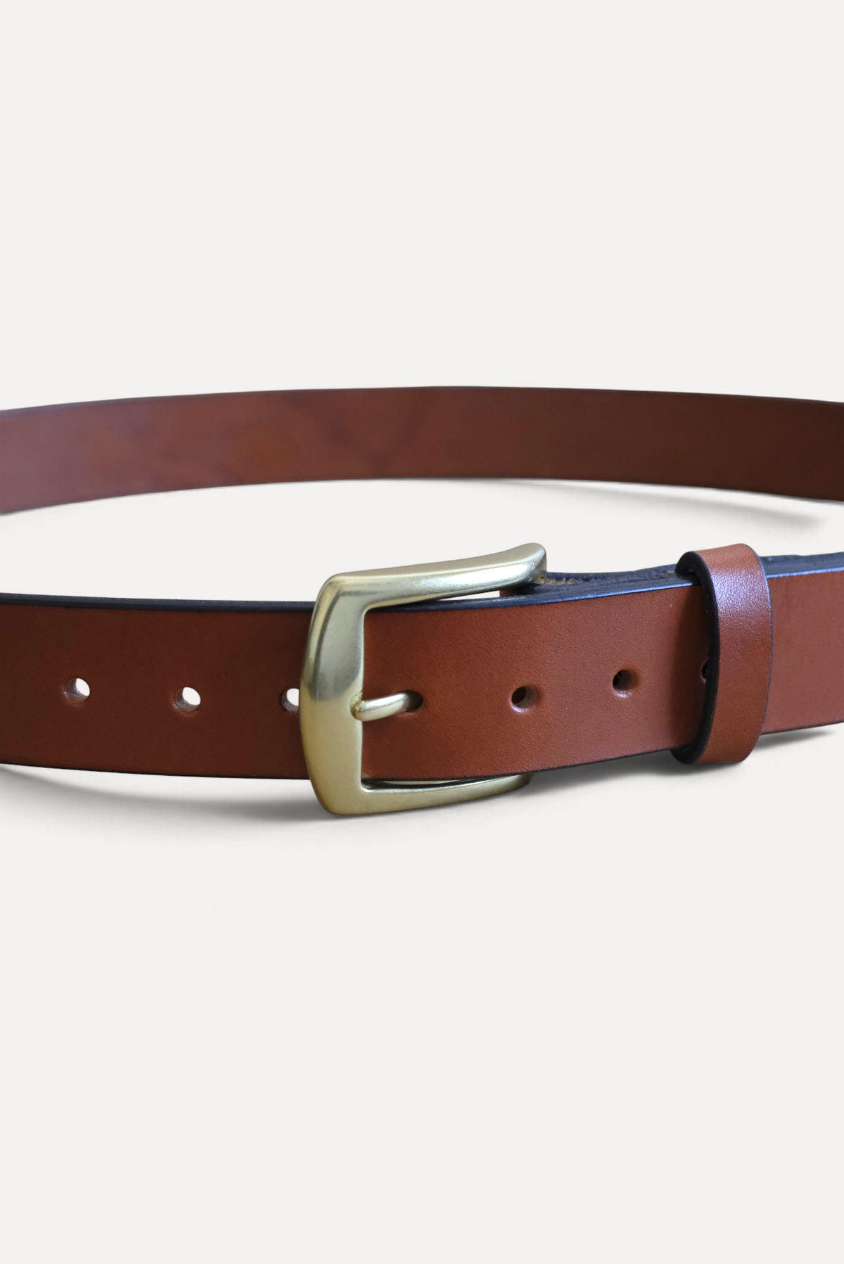 Wilkinson's Fine Goods 1.25 inch chestnut bridle leather belt with a solid brass buckle and hand-burnished edges.