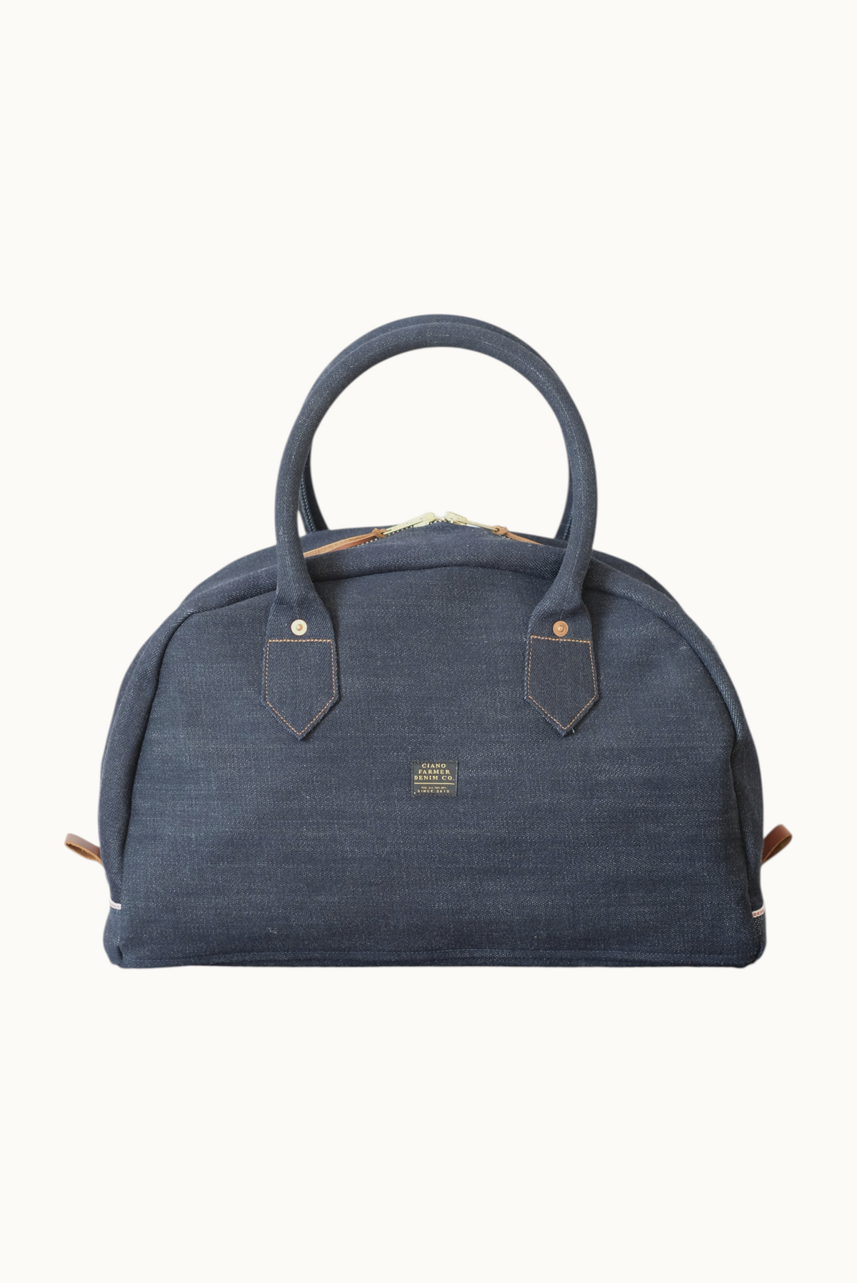 Wilkinson's Fine Goods Ciano Farmer Denim weekender bag in dark indigo Cone Mills denim with leather accents.