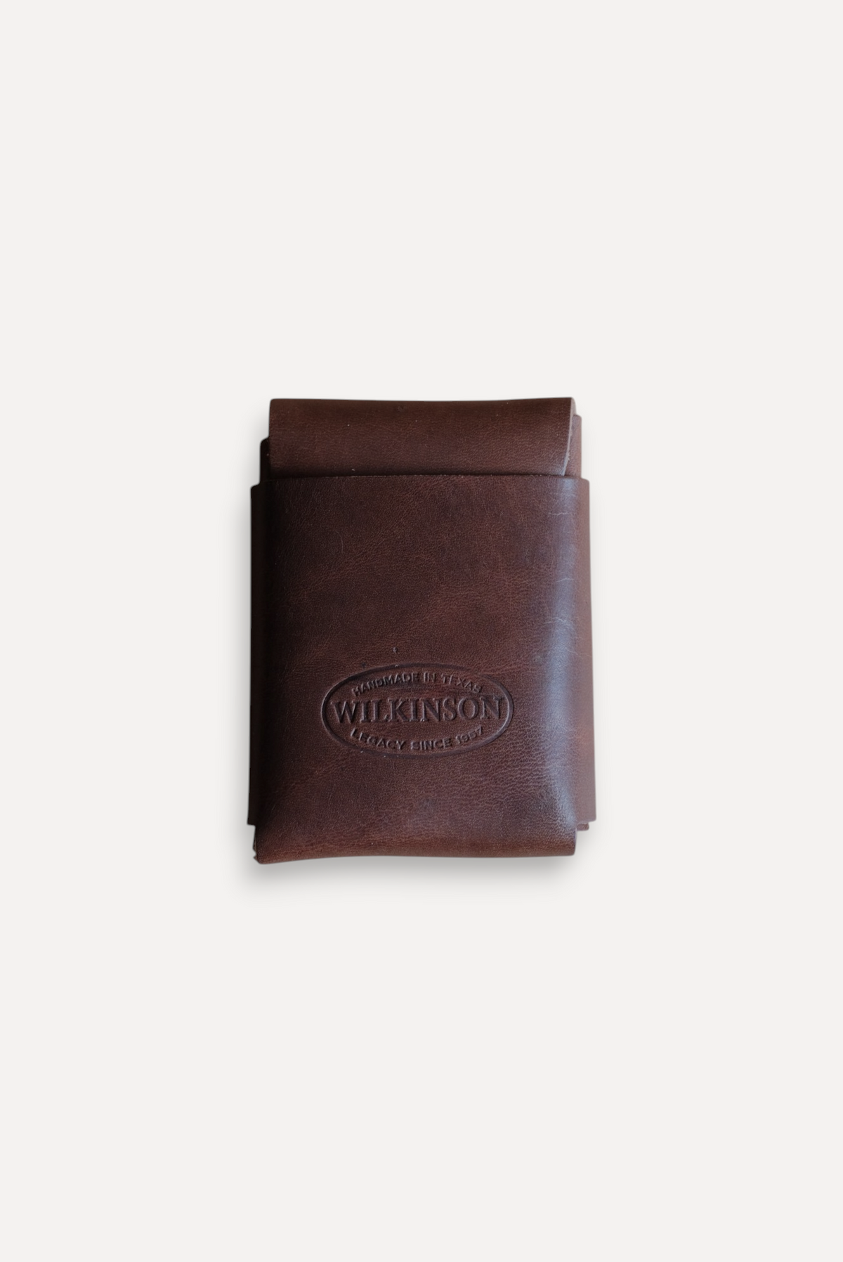 Wilkinson's Fine Goods Fry wallet in brown full-grain leather with a minimalist stitch-free design and logo stamp.