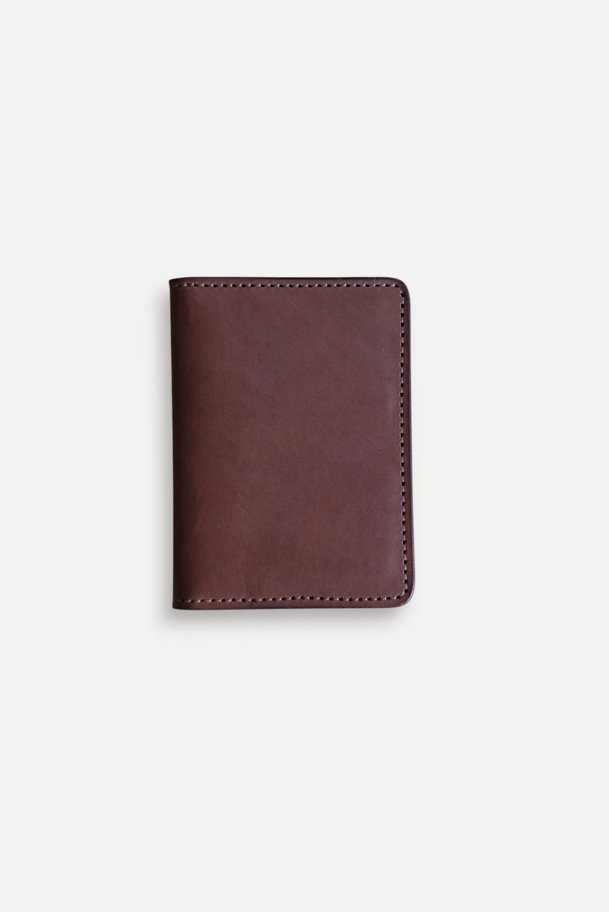 Wilkinson's Fine Goods Trinity wallet in brown full-grain American leather with durable stitched edges.